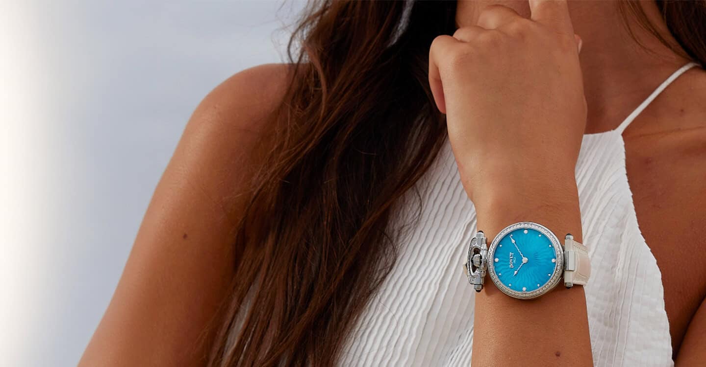 Elegant Fleurier timepiece with a vibrant blue dial and white strap, showcasing craftsmanship and st.