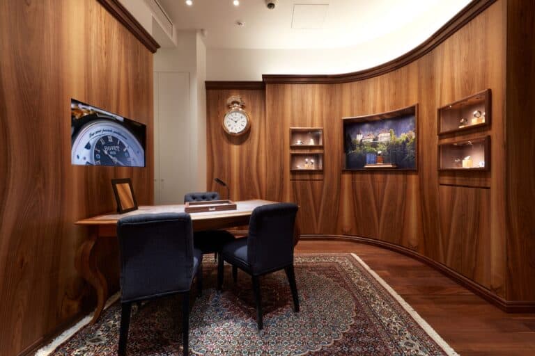 Elegant interior of Bovet Tokyo with wooden paneling and sophisticated decor, showcasing luxury time.
