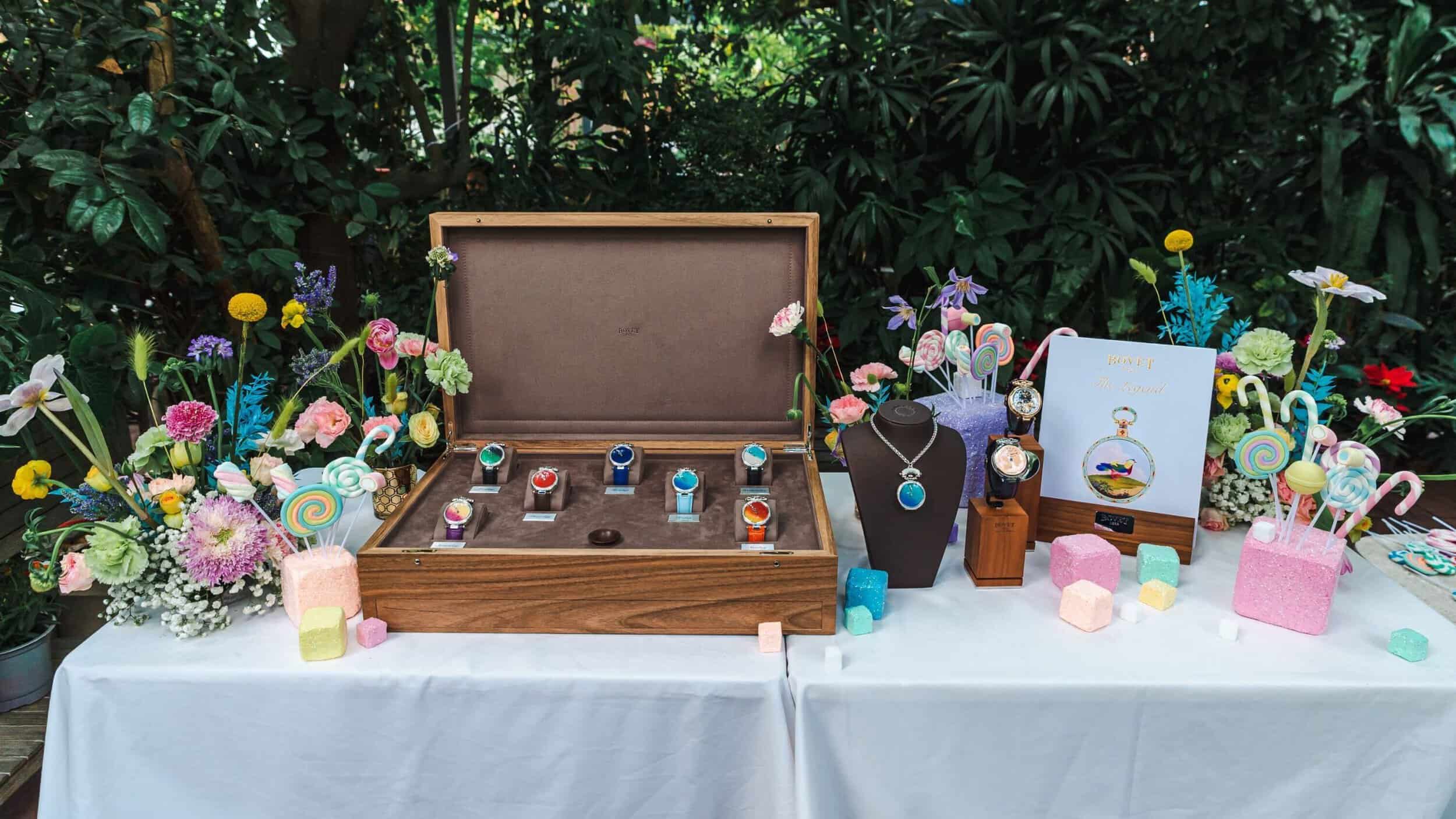 Elegant timepiece collection displayed with colorful accessories and floral arrangements, perfect fo.