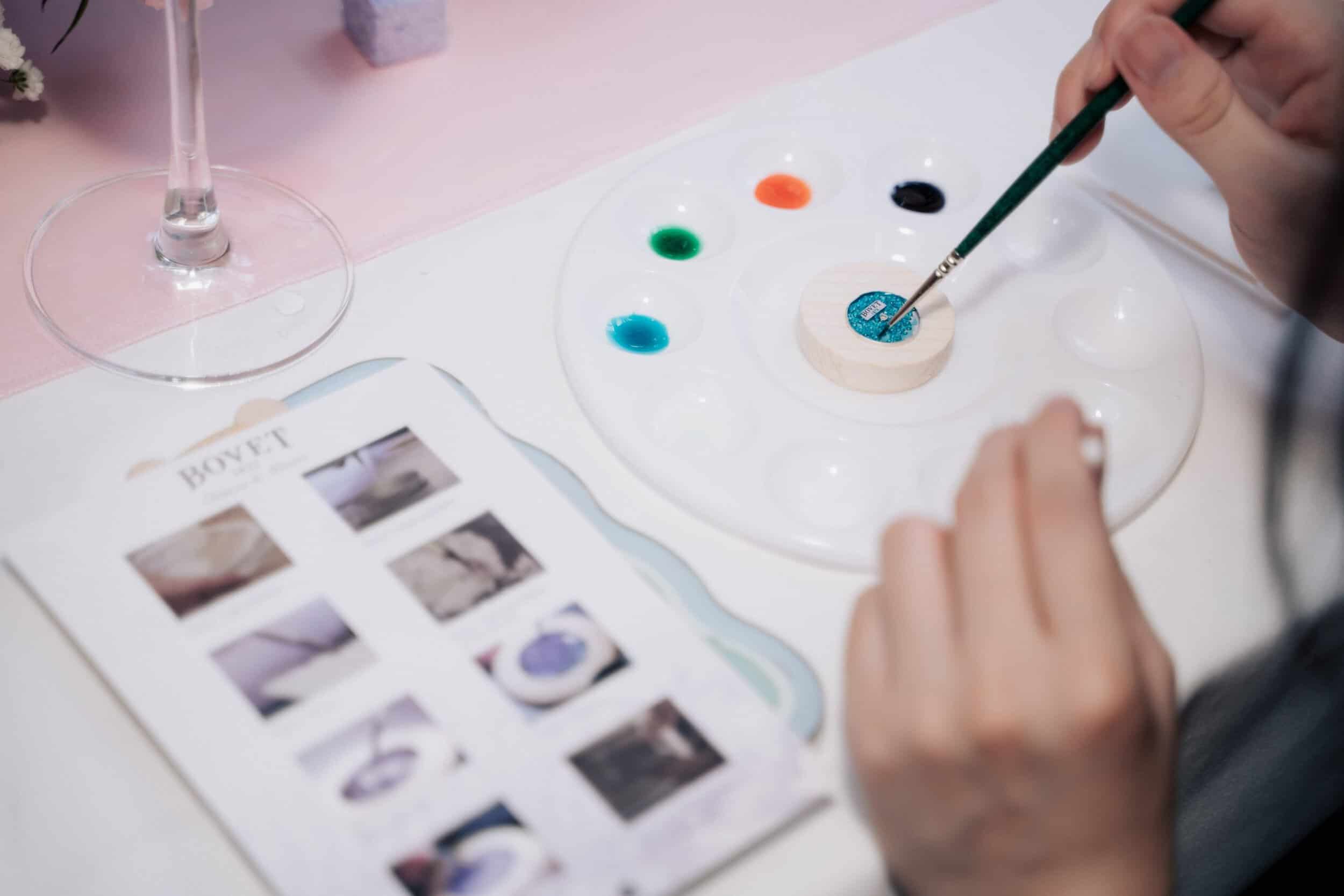 Luxurious timepiece design process with vibrant paint colors and detailed craftsmanship.