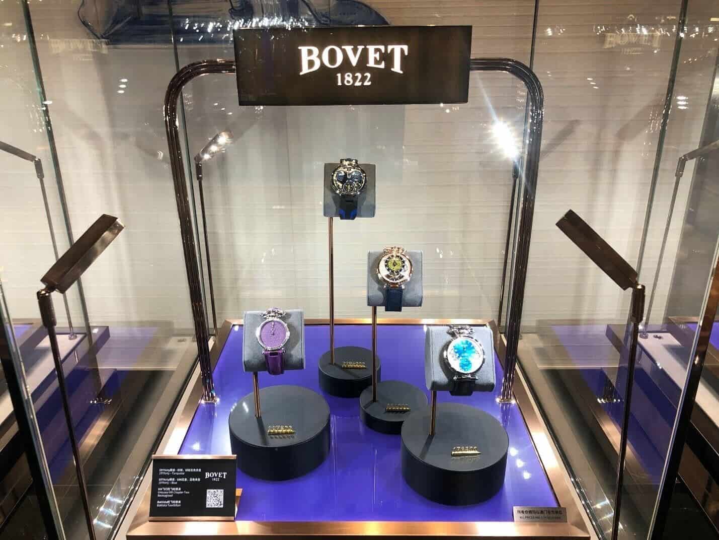 Elegant Bovet timepieces displayed in a glass case, highlighting craftsmanship and luxury.