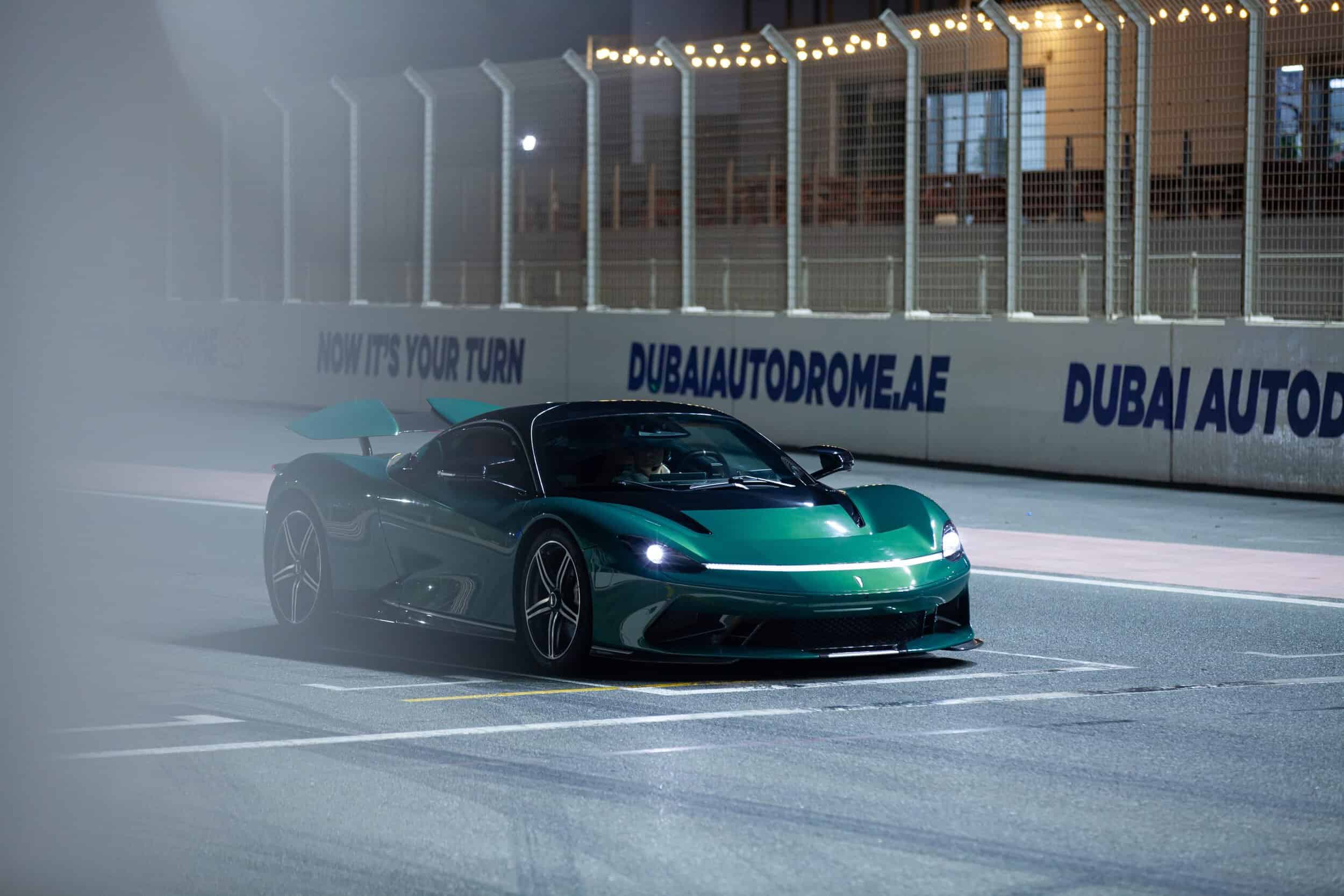 High-performance hypercar racing on track with sleek design and advanced engineering.