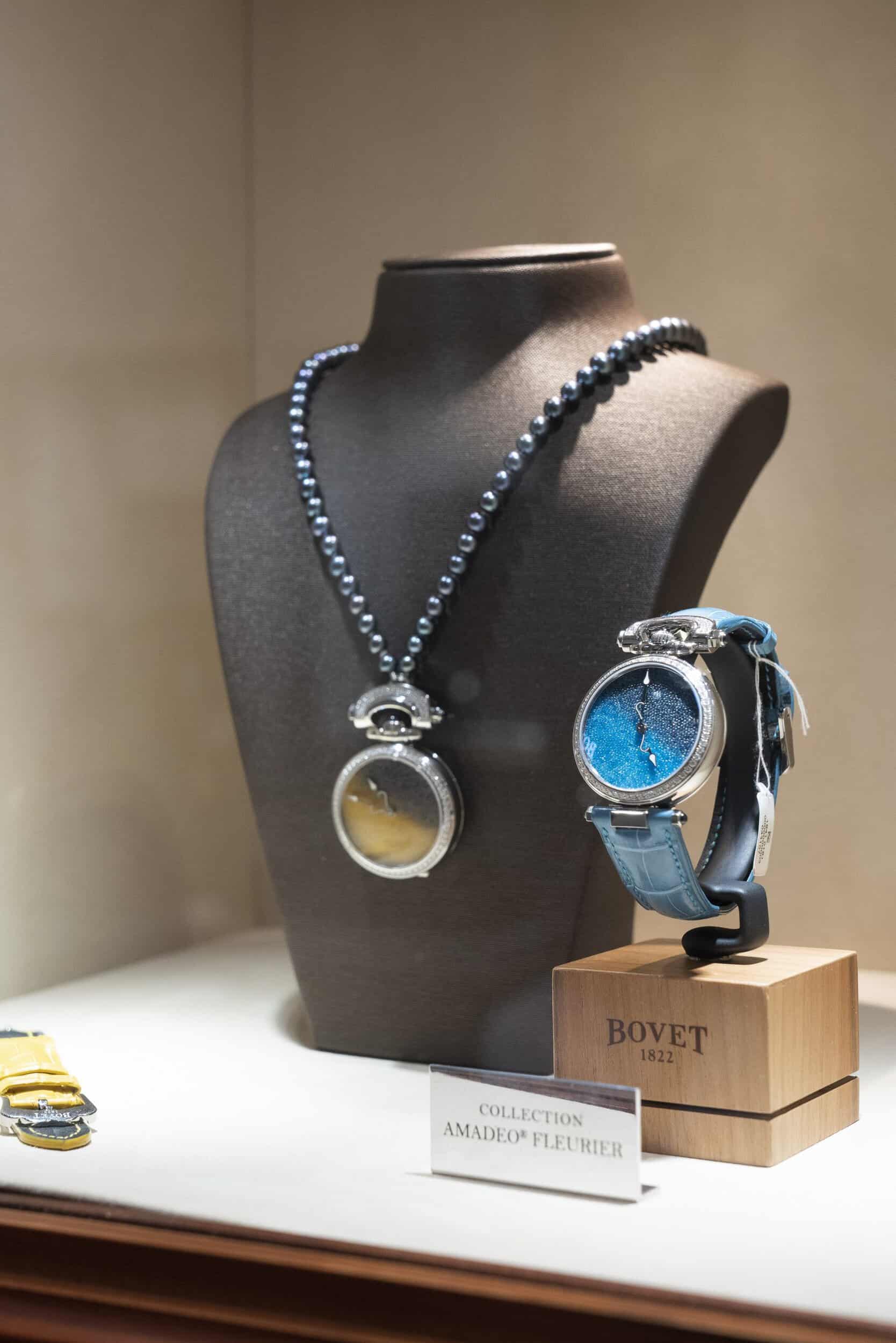 Elegant Bovet timepiece with a blue dial and leather strap, displayed on a black bust for a luxuriou.