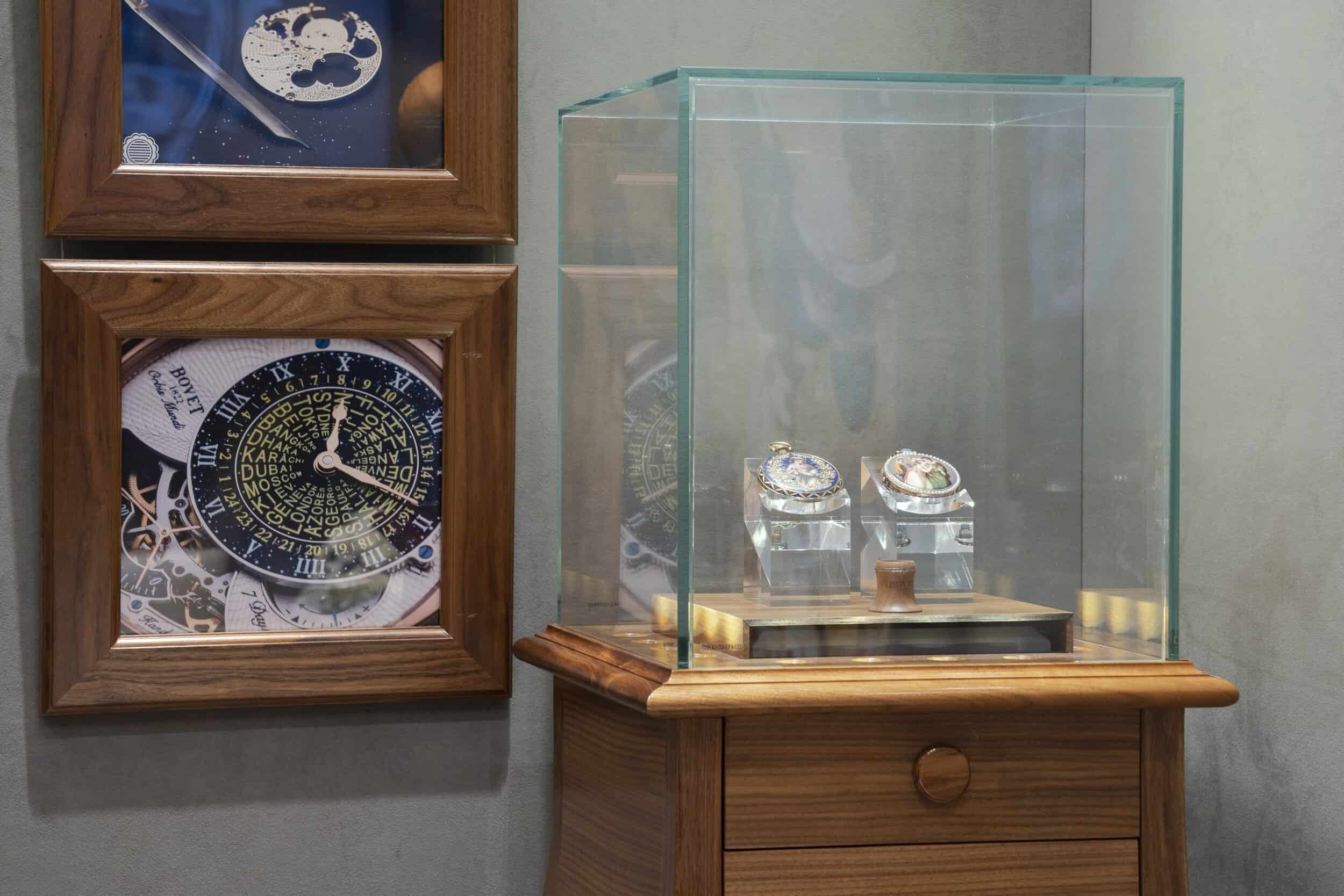 Elegant display of intricate Bovet timepieces in a glass case.