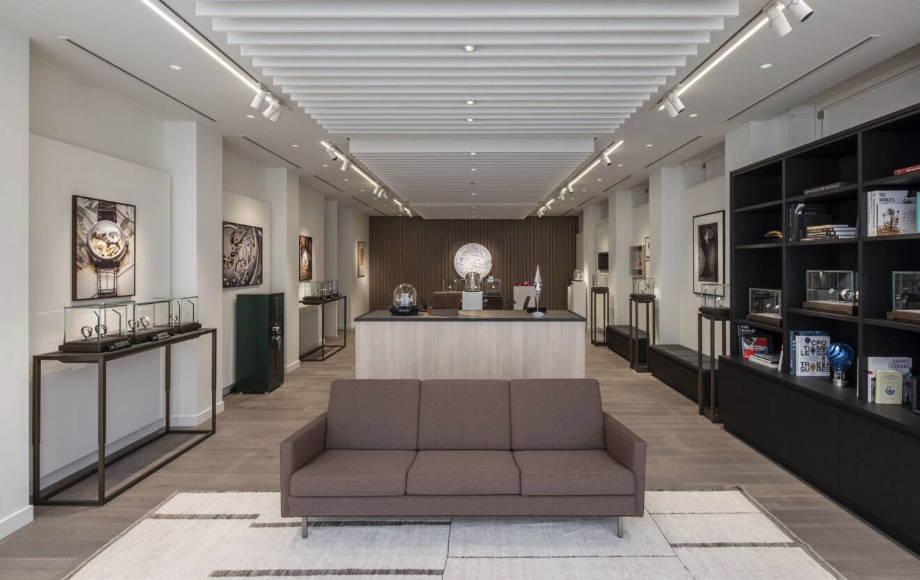 Elegant Bovet timepieces displayed in a modern showroom with sleek furniture and artwork.